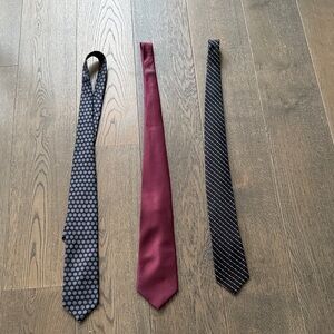 Three pack of Men’s ties. The red tie has light dusting on the top.
